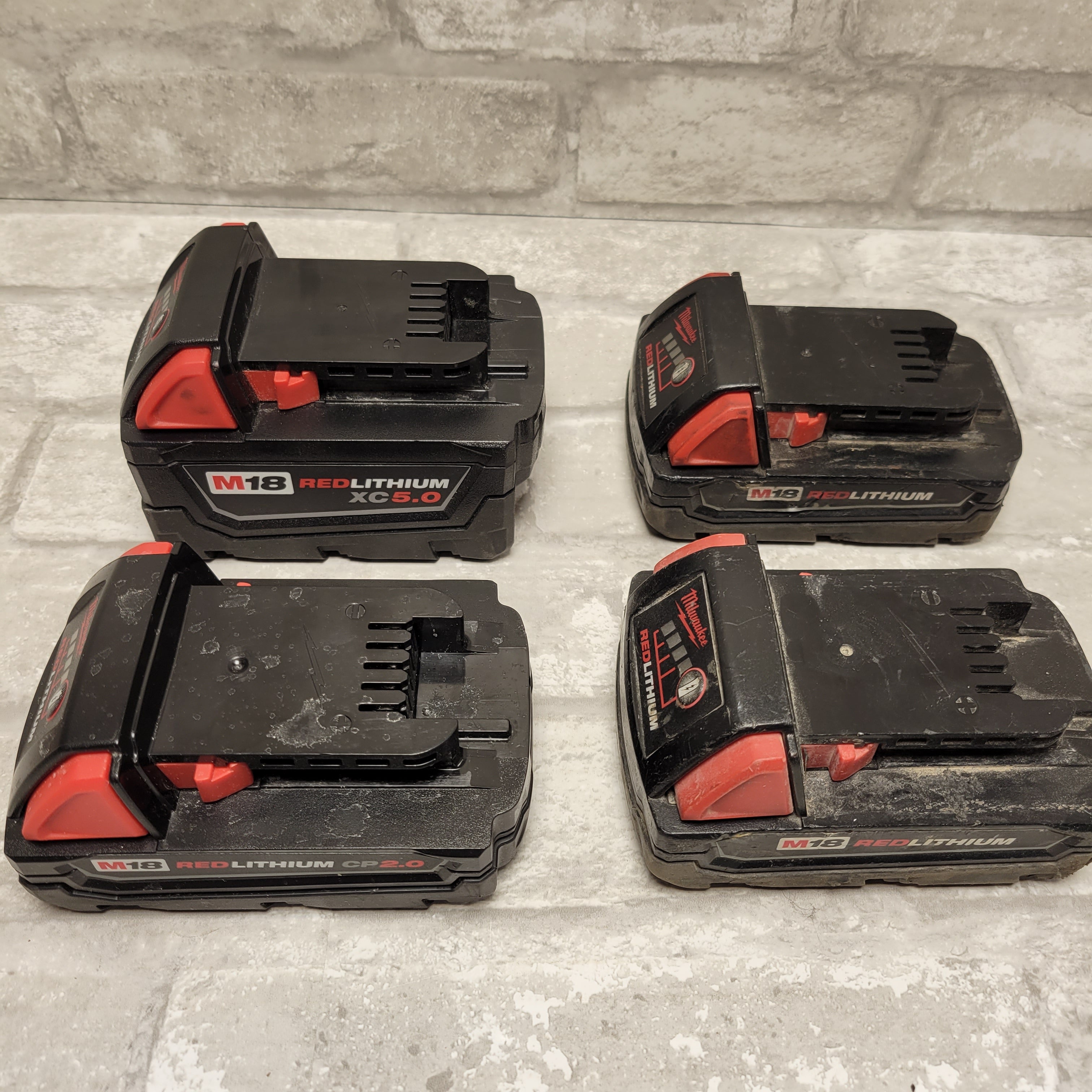 Milwaukee M18 Battery, Lot of 4, *FOR PARTS/DAMAGED* (7951524397294)